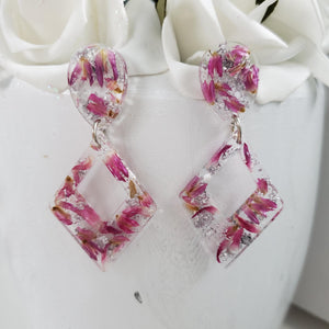 Handmade real flower long triangle stud earrings made with red clover flowers and silver leaf preserved in resin.