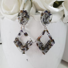 Load image into Gallery viewer, Handmade real flower long triangle stud earrings made with lavender petals and silver leaf preserved in resin.