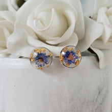 Load image into Gallery viewer, Handmade tiny real flower stud earrings preserved in resin. - blue and gold - Flower Post Earrings, Resin Earrings, Round Earrings