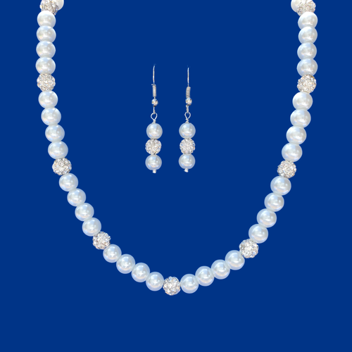 handmade pearl and crystal necklace accompanied by a pair of drop earrings