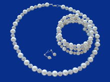 Load image into Gallery viewer, handmade pearl and crystal necklace accompanied by an expandable, multi-layer, wrap bracelet and a pair of crystal stud earrings