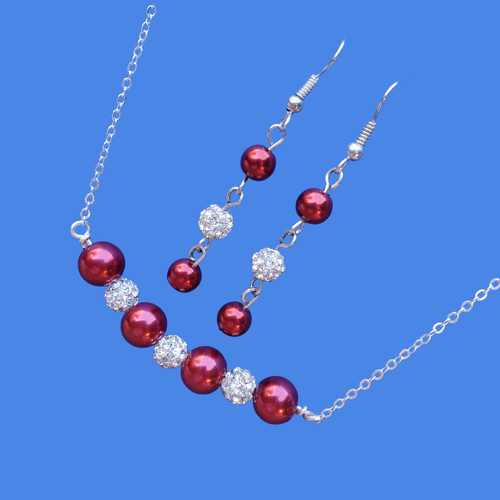 handmade pearl and crystal bar necklace accompanied by a pair of drop earrings