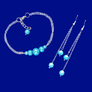 handmade pearl bar bracelet accompanied by a pair of multi-strand drop earrings