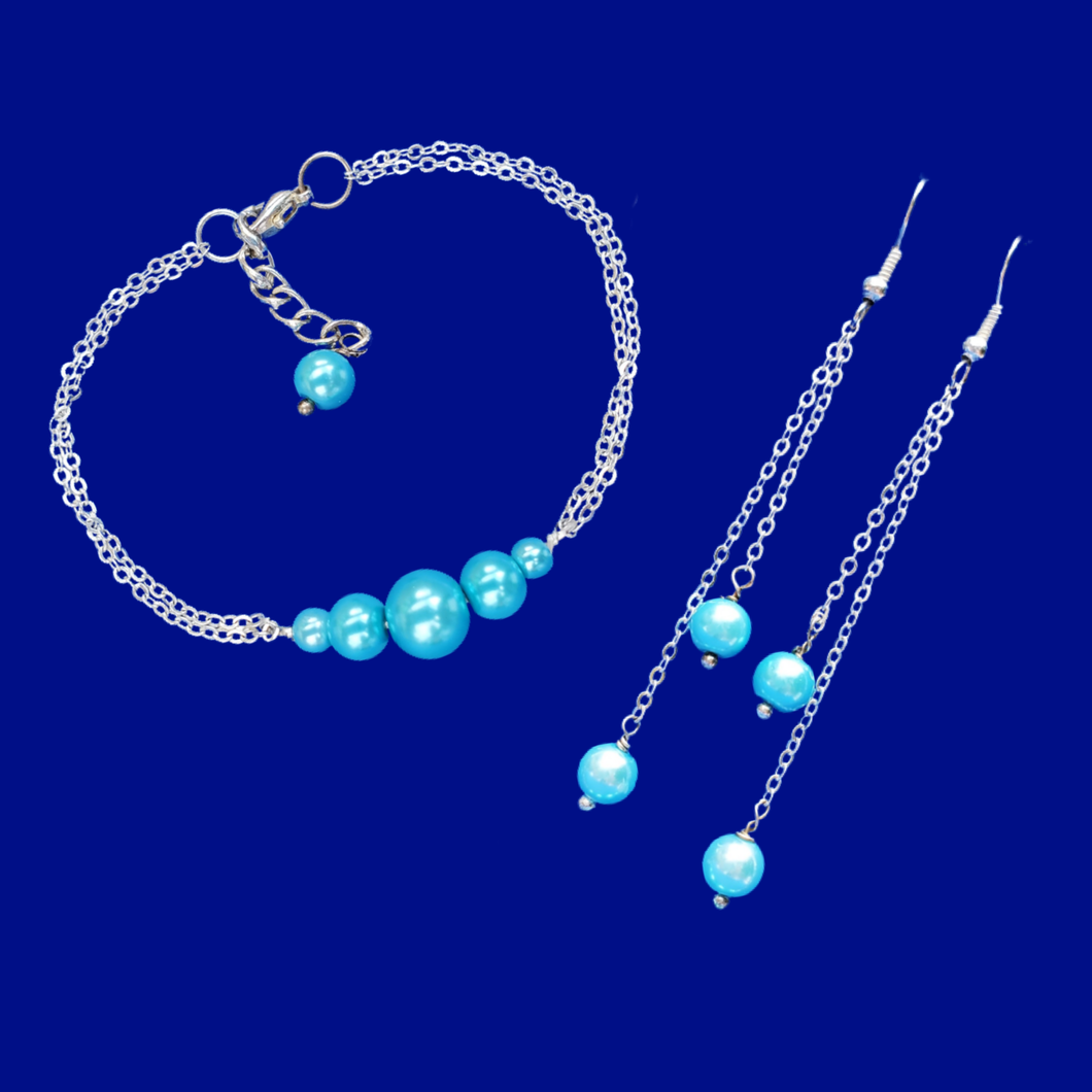 handmade pearl bar bracelet accompanied by a pair of multi-strand drop earrings