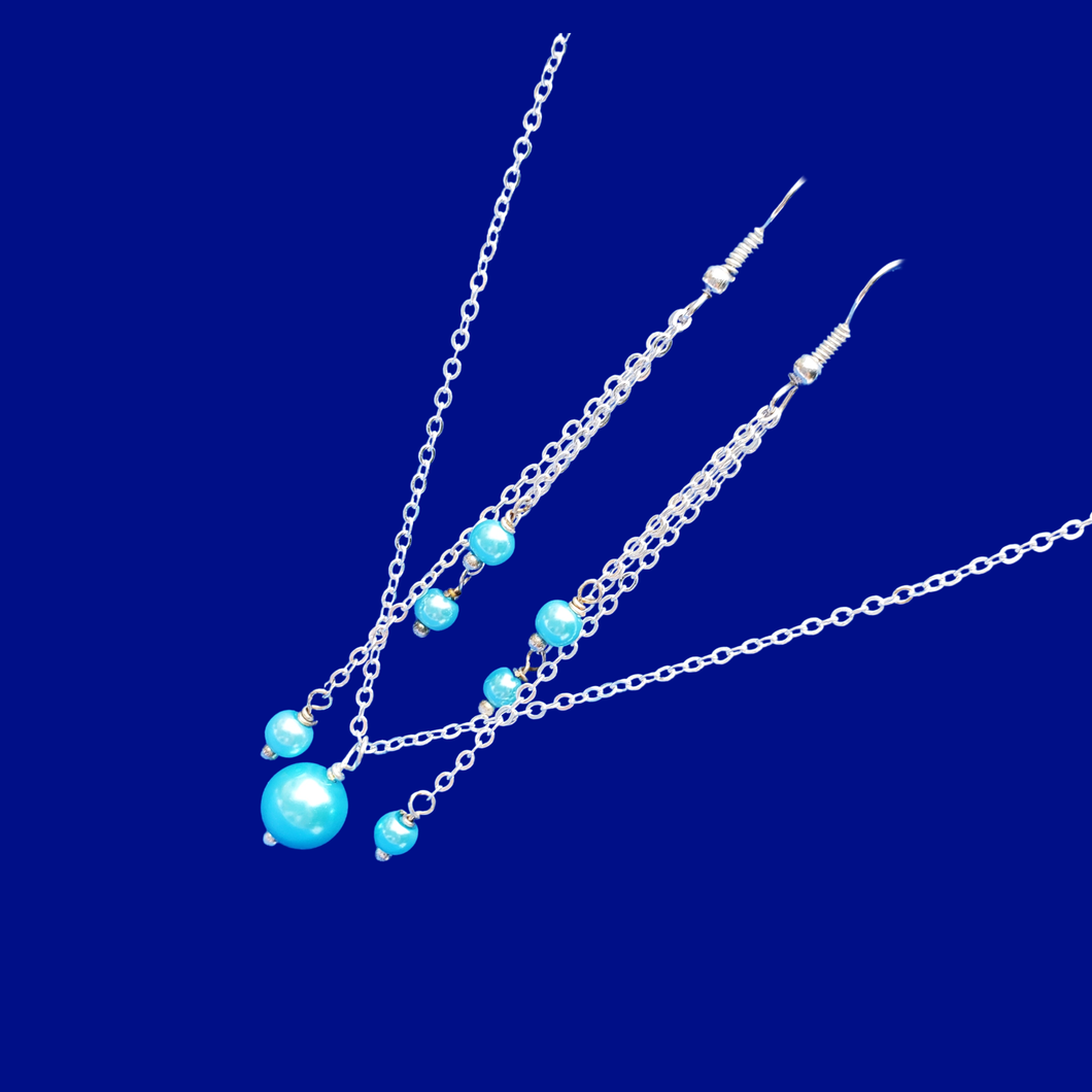 drop necklace accompanied by a pair of multi-strand drop earrings